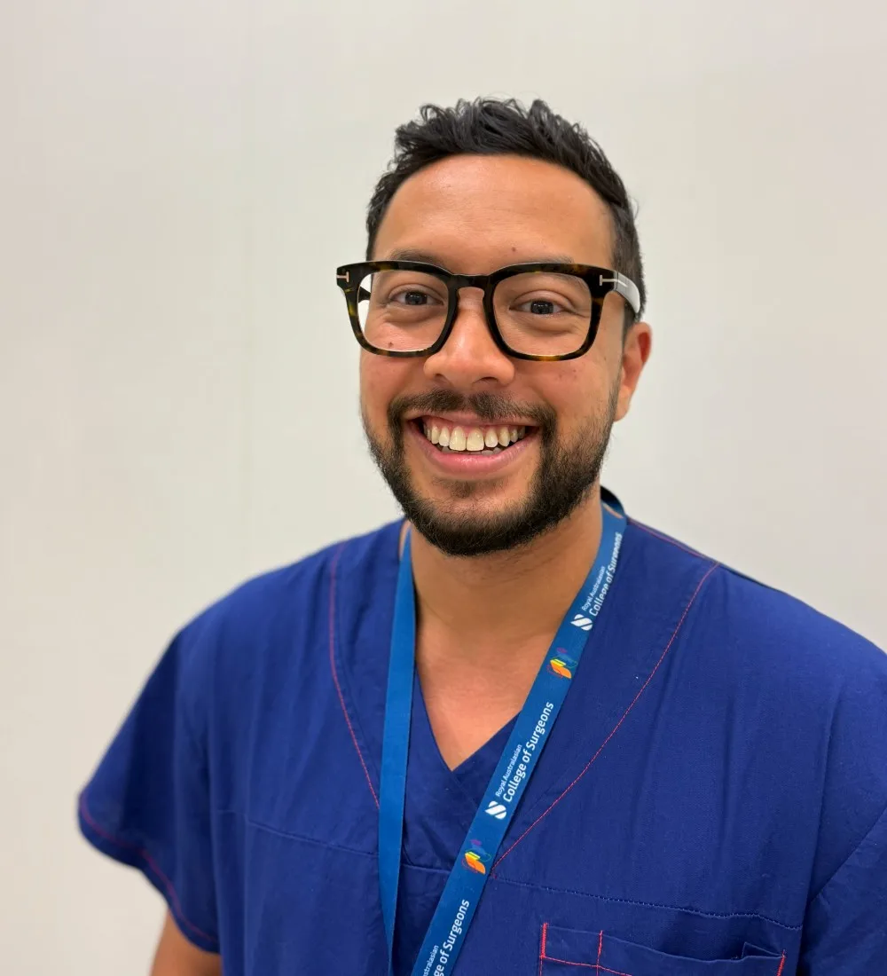 Dr Joel Rabindran in theatre scrubs