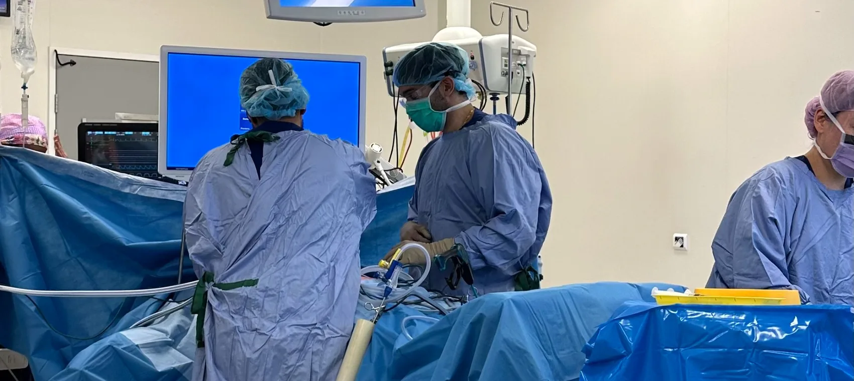 Dr Joel Rabindran operating with his theatre team